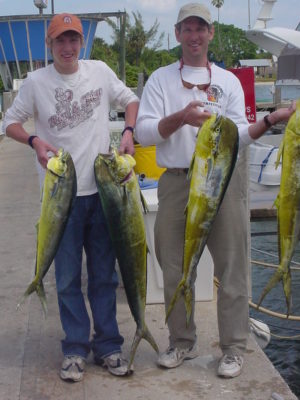 Jeff and son with dolphin